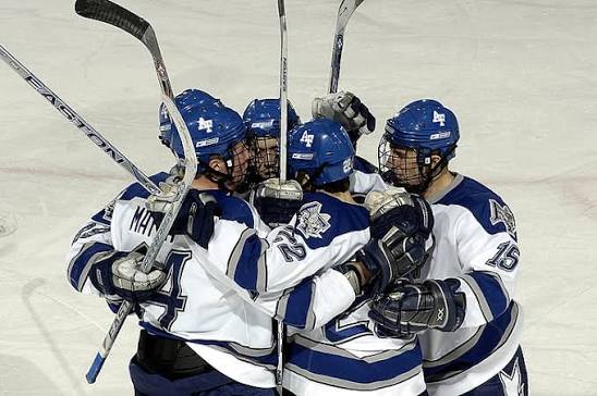 five-ice-hockey-players-huddled-in-hockey-arena